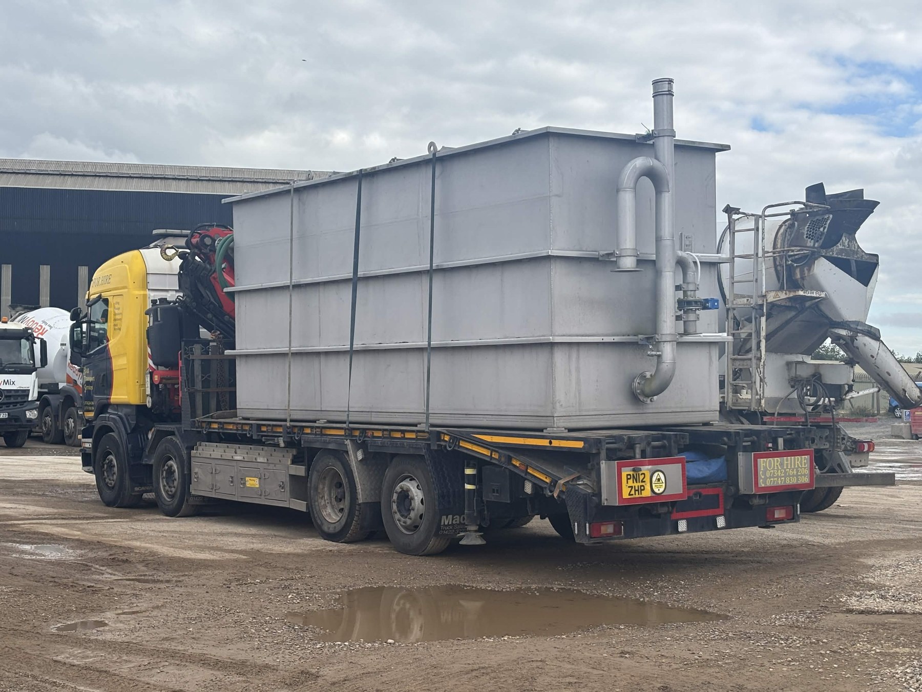 HIAB Truck hauling tank